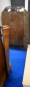 A vintage frameless long wall mirror