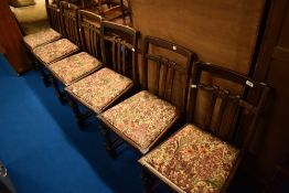 An early 20th Century oak gateleg dining table and set of six similar period dining chairs