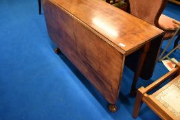A Victorian mahogany dining table having long drop flaps, shaped leg and ball & claw feet