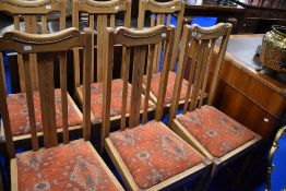 A set of six early 20th Century light oak rail back dining chairs