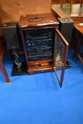 A selection of Kenwood hifi seperates in mahogany cabinet and a pair of mission speakers on stands