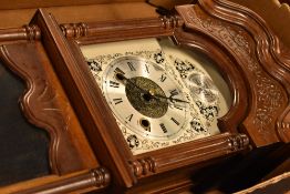A reproduction mahogany wall clock