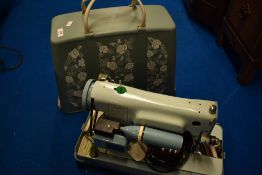 A vintage Jones sewing machine in floral case