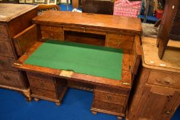 A 19th Century and later walnut desk having concealed fitted interior with some later fittings