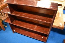 A vintage stained frame bookshelf having historical light fitting (not connected/not safe)