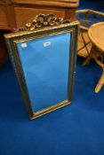 A modern antique effect gilt frame wall mirror