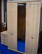 A laminate wardrobe and bedside chest