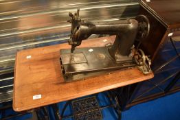 A Victorian treadle sewing machine , American made, Wheeler and Wilson, Bridgport, heavy cast and