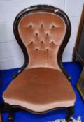 A Victorian mahogany framed nursing chair having later button back upholstery