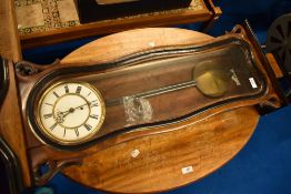 A 19th Century mahogany and walnut cased wall clock having enamelled dial with subsidiary seconds