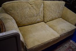 A cream upholstered settee , possibly Tetrad
