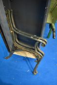 A pair of cast iron bench ends