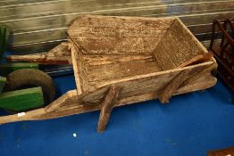 A vintage wooden wheelbarrow