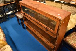 A late 19th or early 20th Century three tier stacking bookcase within later reinforced frame,