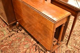 A Victorian mahogany gateleg dining table having turned legs and full length drop flaps, width