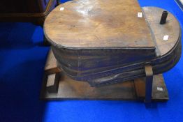 An antique forge or similar bellows