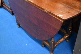 A period oak gateleg dining table having frieze drawer and turned frame