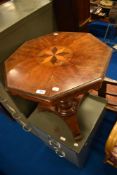 A 19th Century mahogany occasional table having inlaid octagonal top on William IV style trefoil