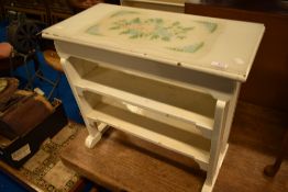 A vintage painted Arts and Crafts style occasional table with shelves under