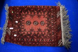 A traditional prayer rug, approx. 62 x 52cm