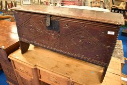 A period oak kist of small proportions having carved detail to front, lozenge and 'date' 1658,
