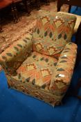 A vintage child's armchair having William Morris style loose cover