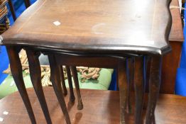A reproduction mahogany nest of three period style tables