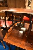 A Victorian mahogany occasional table having shaped top and undertier