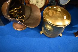 A brass coal bucket, pair fire dogs and a copper coal helmet