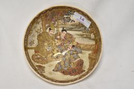 An antique Japanese Satsuama ware bowl decorated with a scene of three samurai.