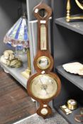 An antique L. Balerna Halifax banjo barometer with a Rosewood case, missing top glass.