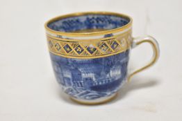 An 18th century Chinese porcelain tea cup having imperial gold decoration with painted finely
