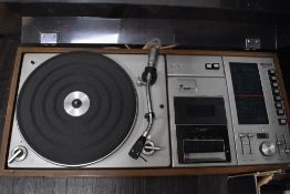 A vintage Sharp SG- 309H cassette and record player music centre. In good condition with dust