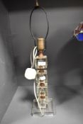 An early 20th century Glass ice cube lamp base with a pull cord switch.