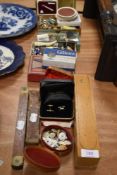 A great selection of curios and trinkets including razors, playing cards, enamel pin badges and cuff