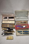 A selection of 20th century fountain ball point and similar pens including Parker, Merlin and