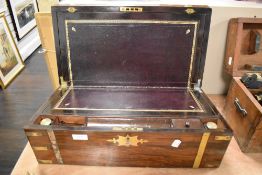 A very fine mid Victorian writing lap desk having rose wood case with brass banding and fitted
