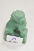 A 20th century Chinese Dog of Fo carved in an apple green jade. 7cm tall