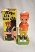 A vintage novelty Weepy the Wee Wee toy figure with box.