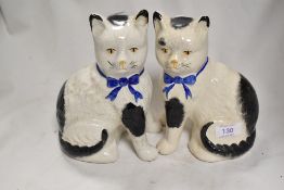A pair of modern cat studies in a Staffordshire flat back design.