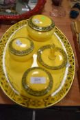 An early 20th century Burleigh ware dressing table set in a yellow and black pattern.