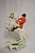 A Beswick Huntsman figure On Rearing Horse no. 868 with Gloss Finish and a similar Hound study.
