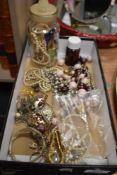 A selection of vintage costume jewellery including a Limit watch, simulated pearls and necklaces.