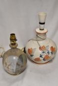 Two vintage studio pottery lamp bases including a hand painted floral base and similar Denby style