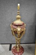 A Wong Lee bronze and porcelain lamp base, decorated with mythical rams heads on three footed hoofed