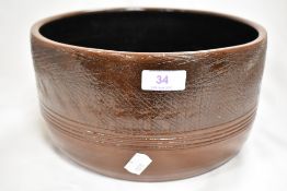 A mid 20th century studio pottery bowl thrown by an understudy of Bernard Leach. 26cm across.
