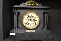 A Victorian slate mantel clock with visible escape and ormolu decoration. Case having damage.