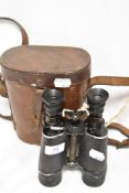 A pair of early 20th century Huet 12x binoculars with case AF.