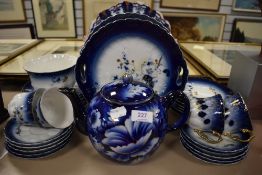 An early 20th century part tea service in a cobalt blue and gilt glaze.