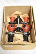 A pair of early 20th century optometrist Oculizer goggles with box.
